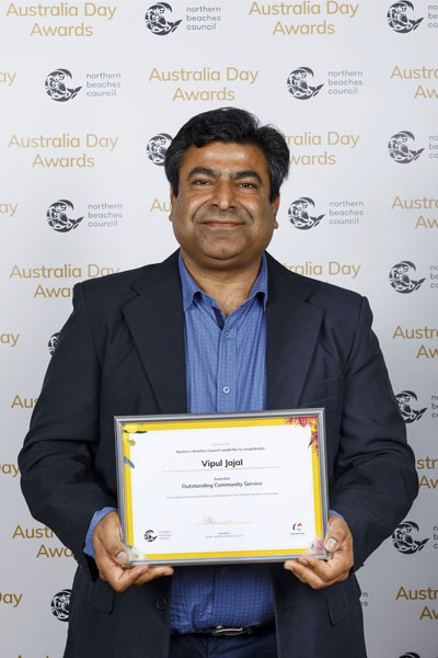 Vipul Jajal holding his certificate