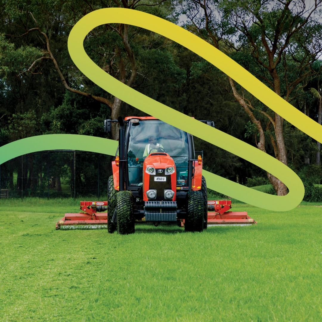 A tractor mowing grass with a decorative ribbon added digitally