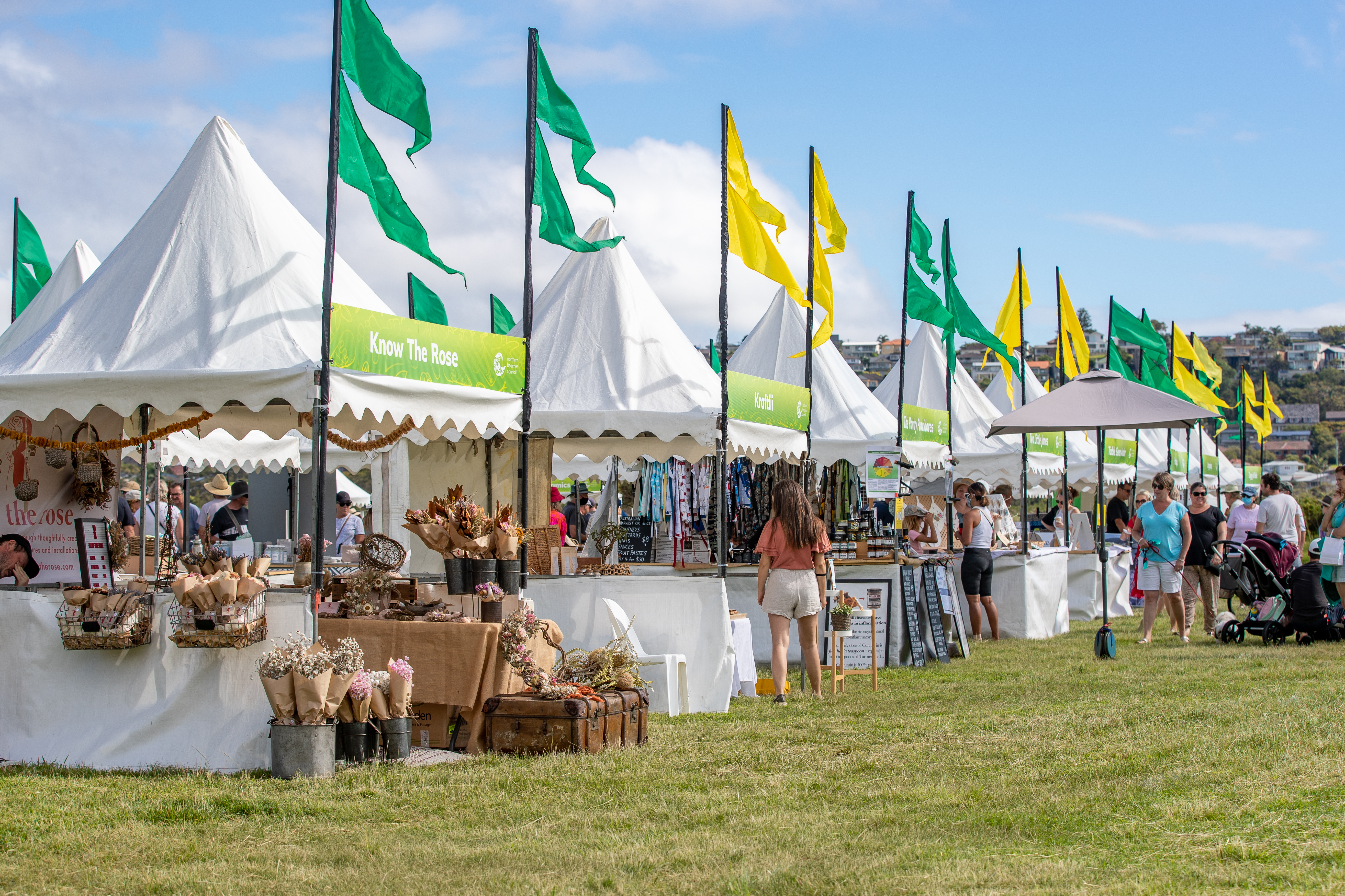 market stalls with green and gold flags