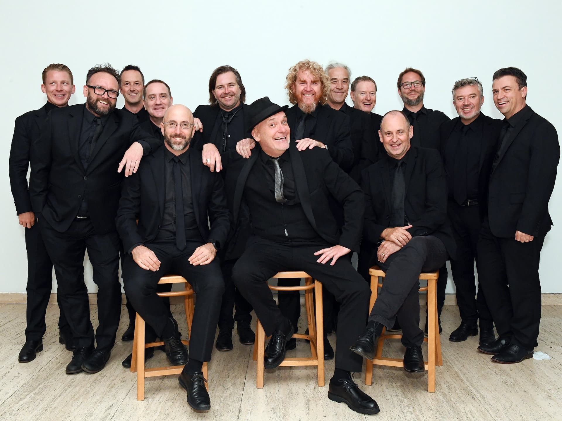 group of jazz musicians dressed in all black