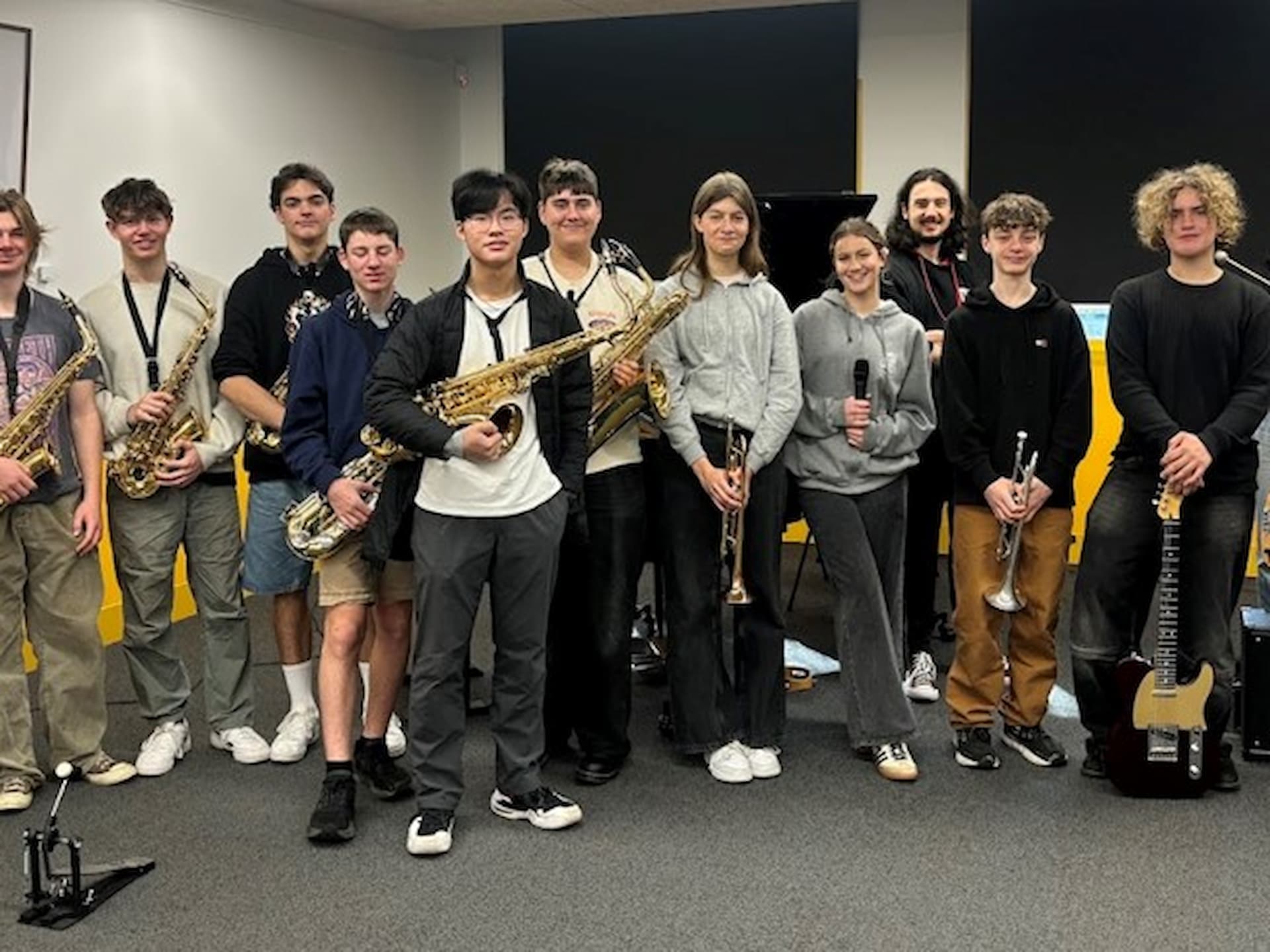 school jazz band posing in music room