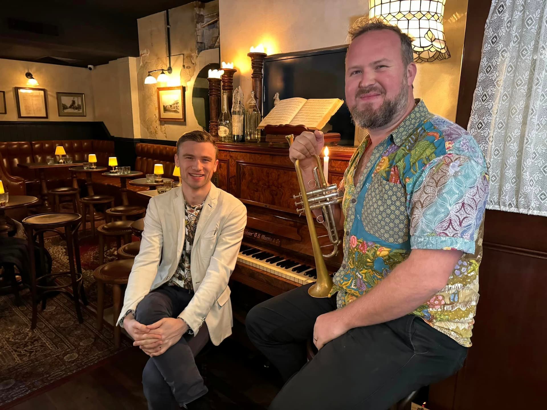 Jazz pianist and horn player in a bar