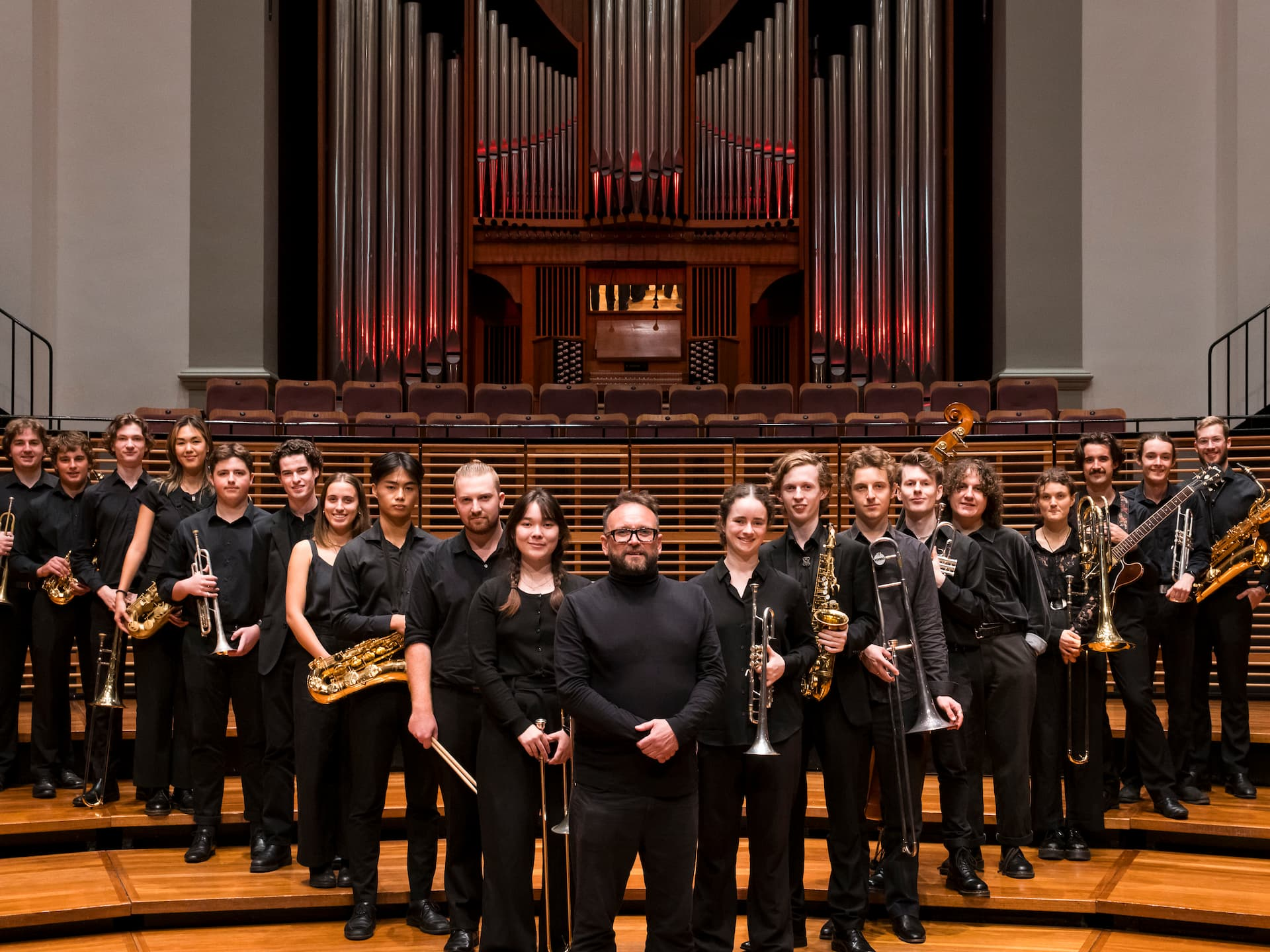 Jazz band standing in front of organ