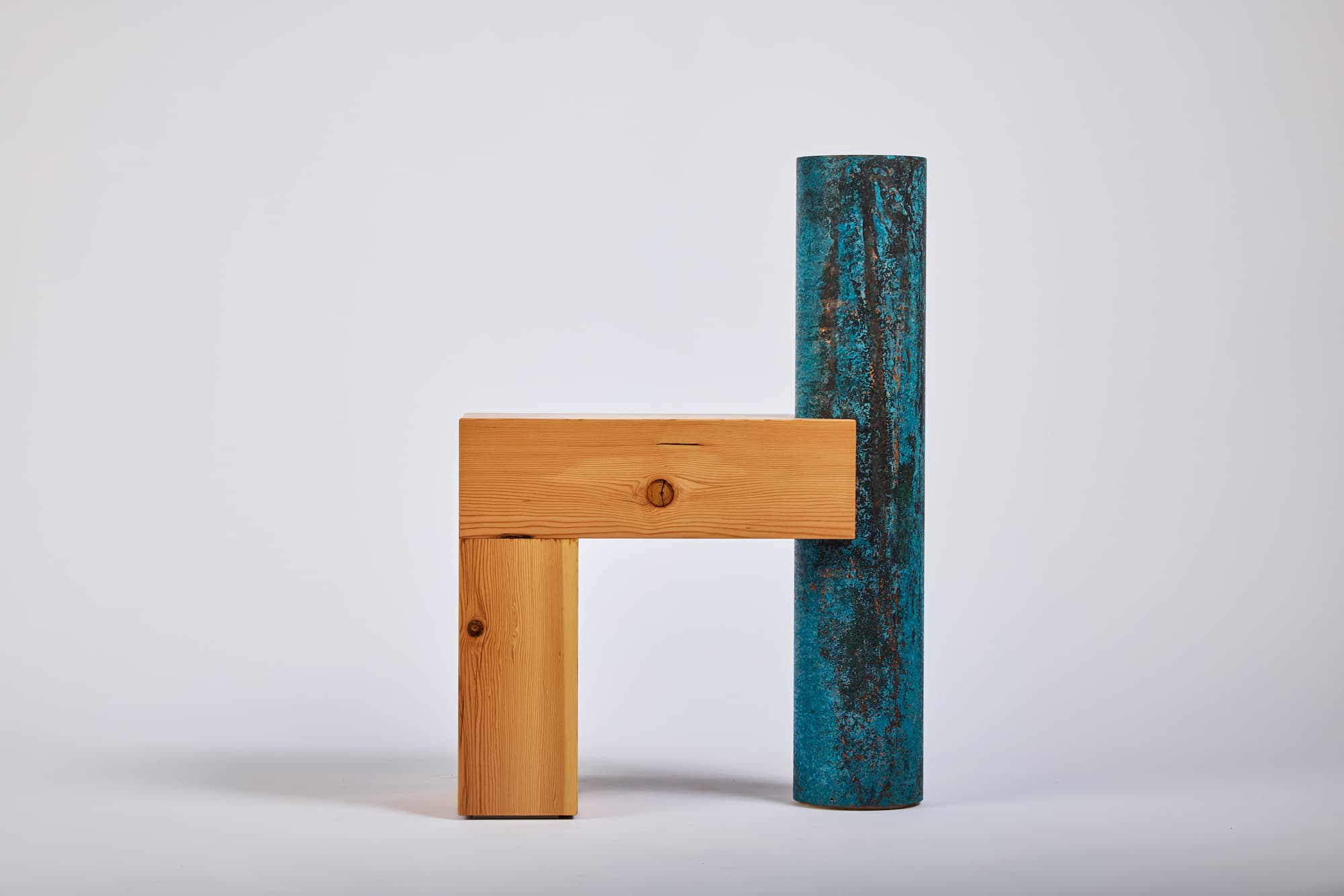 Photo of a chair made of timber and copper