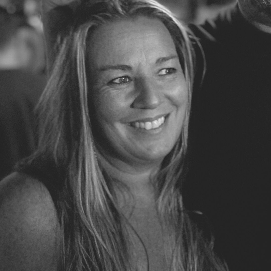 Black and white photo of Claire Morris smiling. 