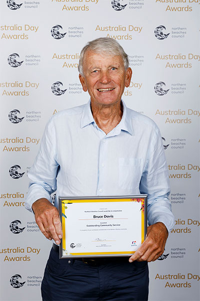 Bruce Davis holding his certificate