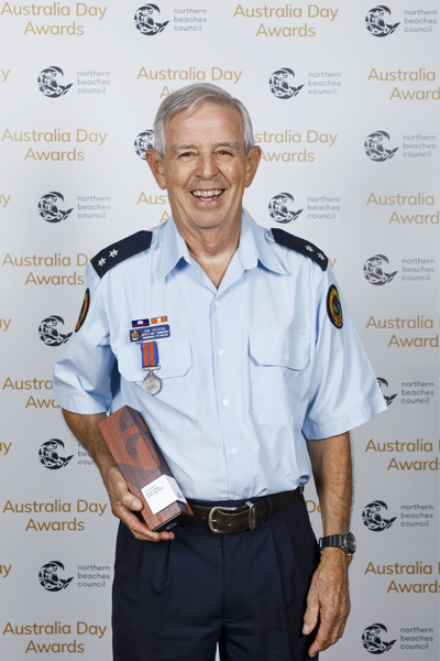 Ian Hocking holding his award