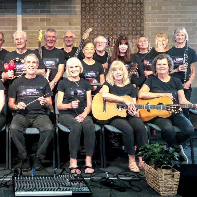 Performers and musicians smiling