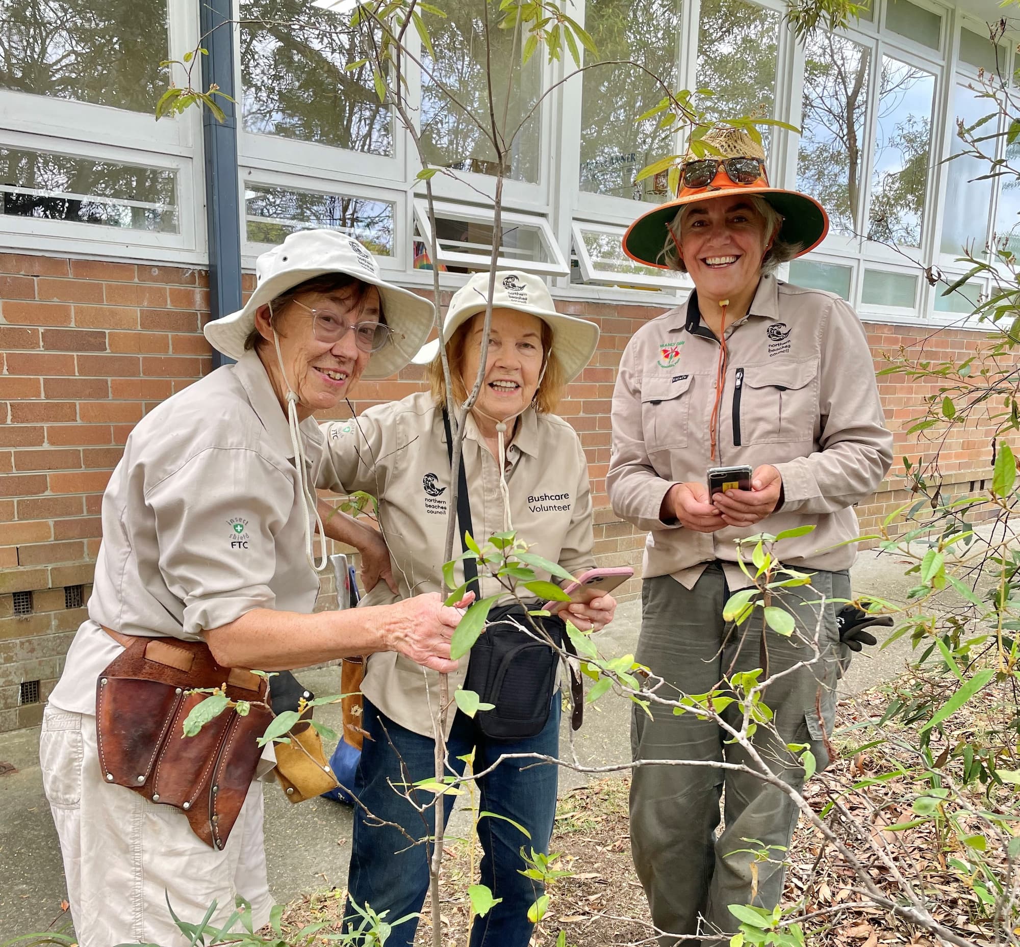 2 volunteers with supervisor at Wakehurst Public School