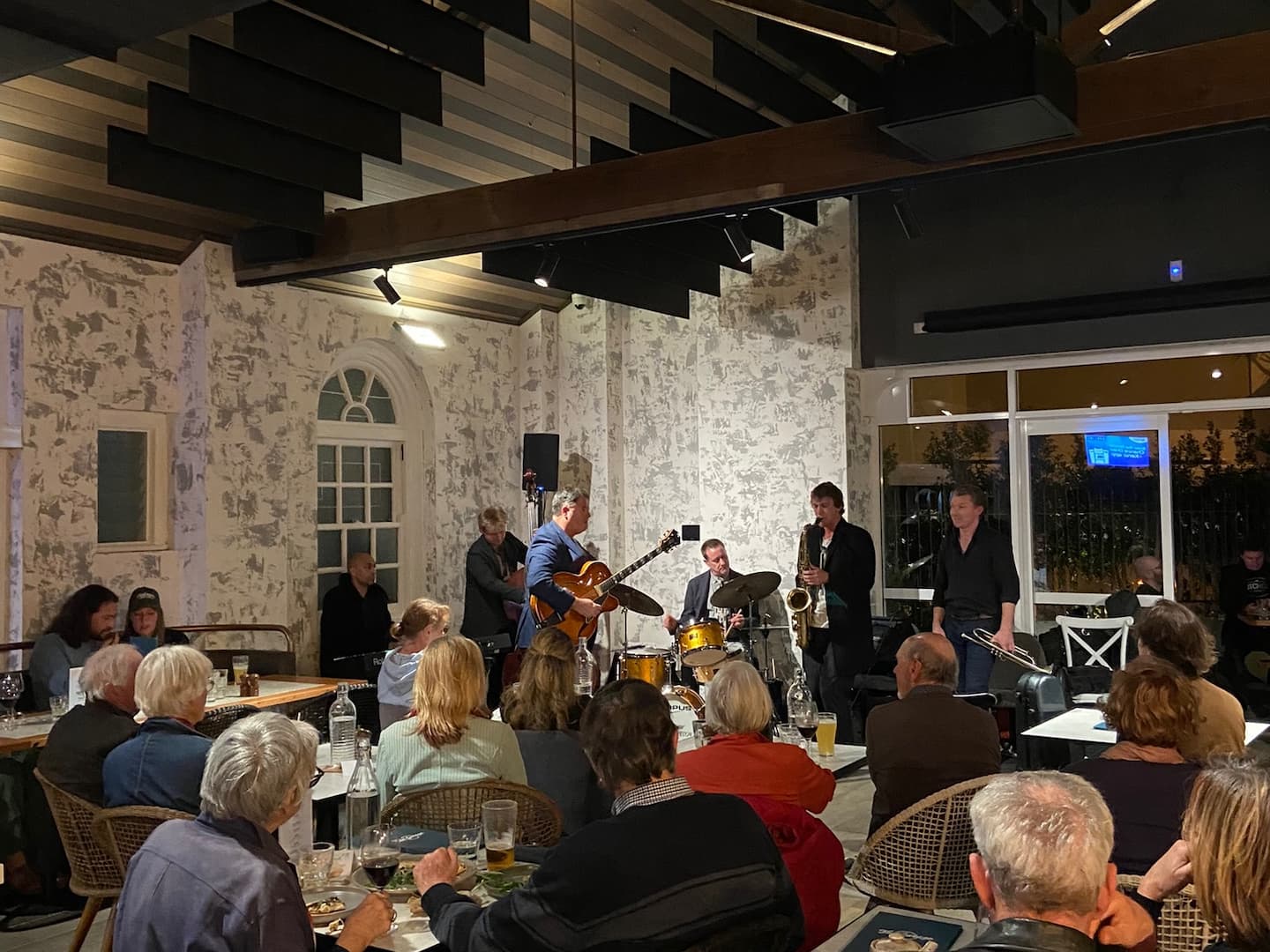 people watching a jazz band at the Manly Club