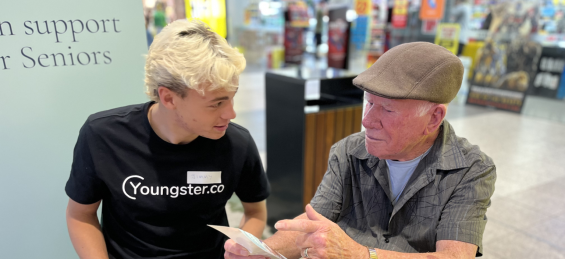 A young person helping a Senior
