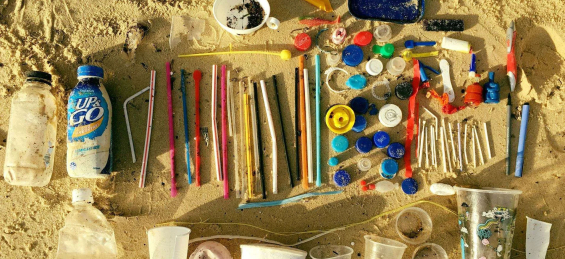 Plastic pollution laid out on the sand