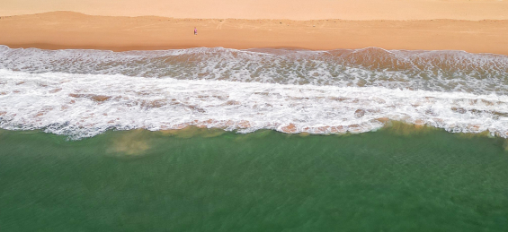 Aerial view of waves and sand 