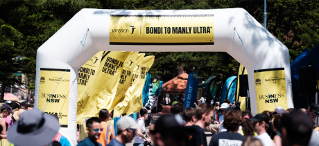 Inflatable saying Bondi to Manly Ultra surrounded by runners