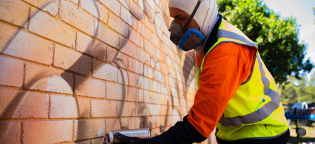 Artist Sofles installing his work in Mona Vale