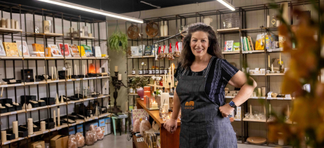 Queen B shopkeeper standing in their store