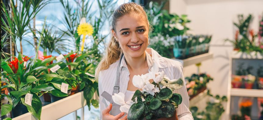 smiling woman holding flowers