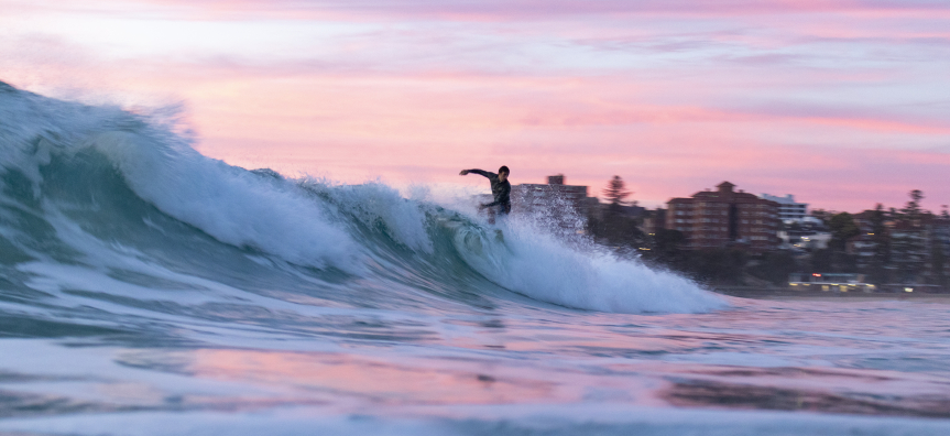 surfer with pink sky