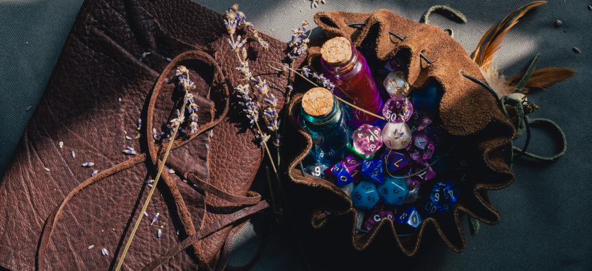 Brown Notebook and a bag of dungeons and dragon dice