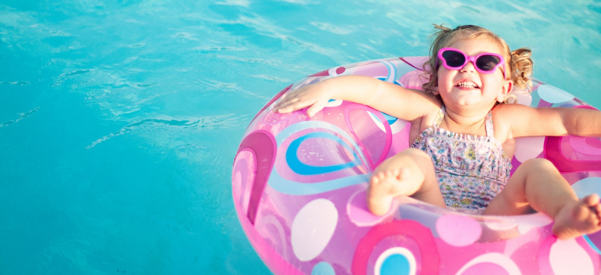 girl with sunglasses in a pool floatie