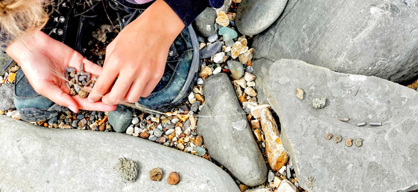 young girl fossil hunting