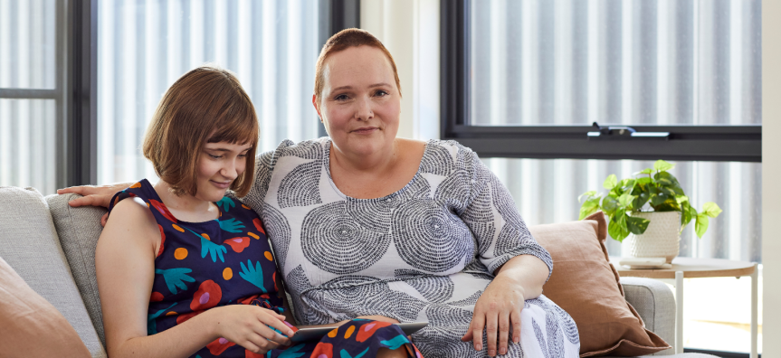 mother and daughter on a couch