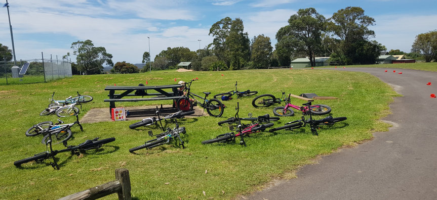 Bikes laying on the grass