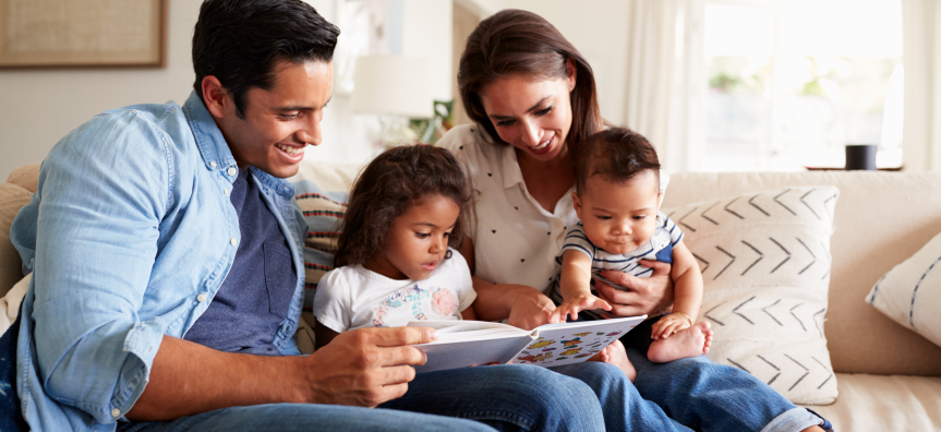 Family reading together on the couch