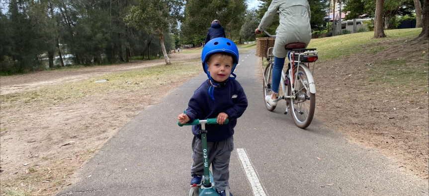 Boy on scooter lagoon park 