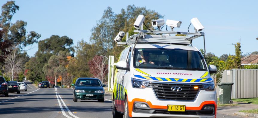 road surveying van and cars