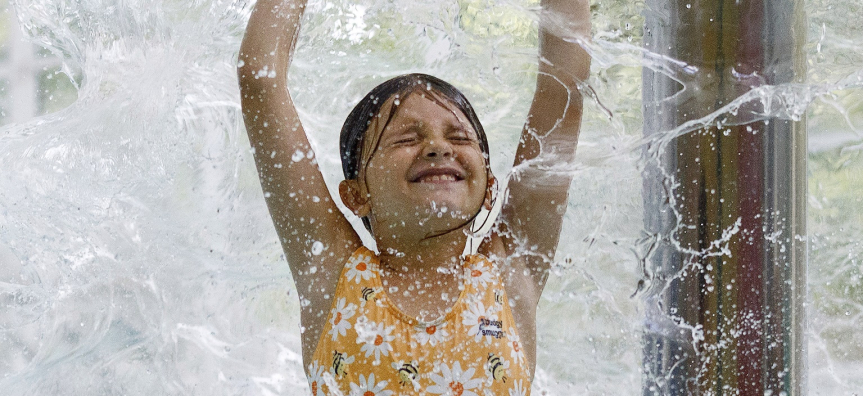 girl being splashed with water