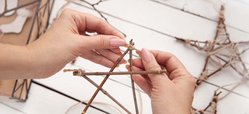 Person making a Christmas decoration