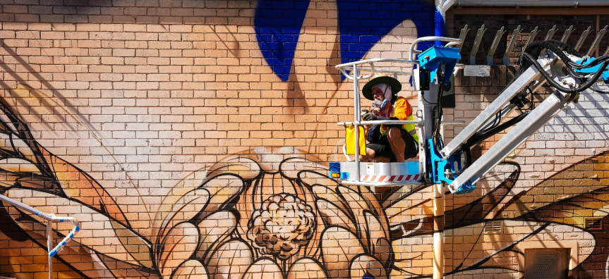 Artist Sofles installing his work in Mona Vale