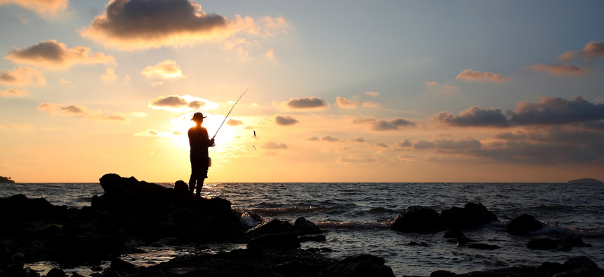 person rock fishing