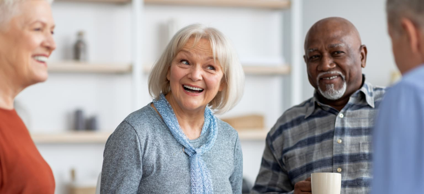 Seniors laughing drinking tea