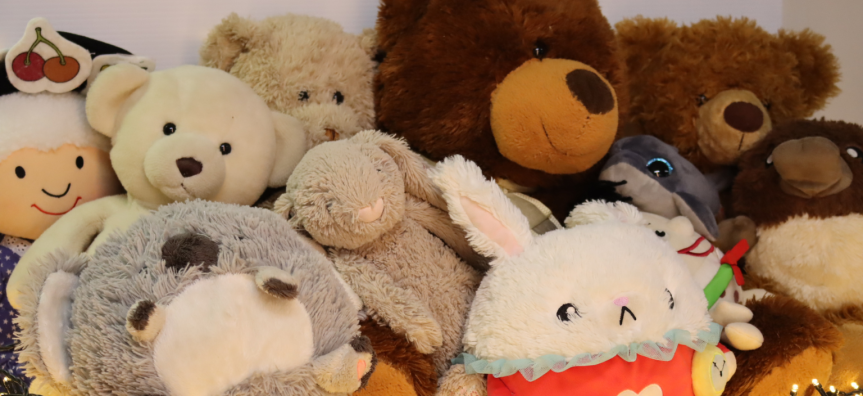 Pile of soft toys surrounded by fairlights