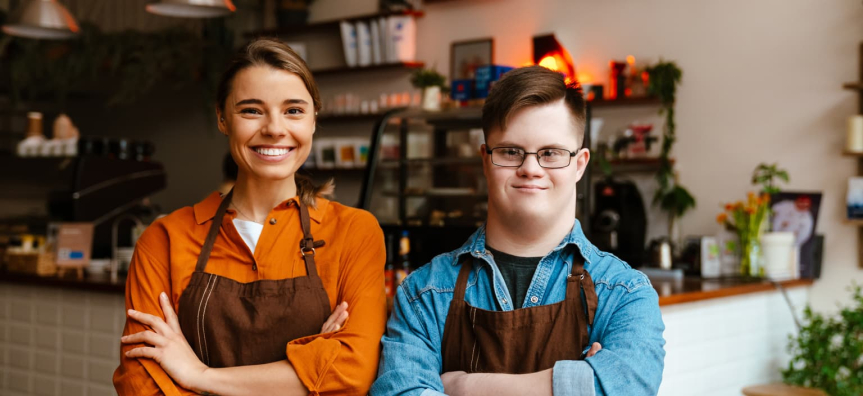 Two cafe workers standing in a shop