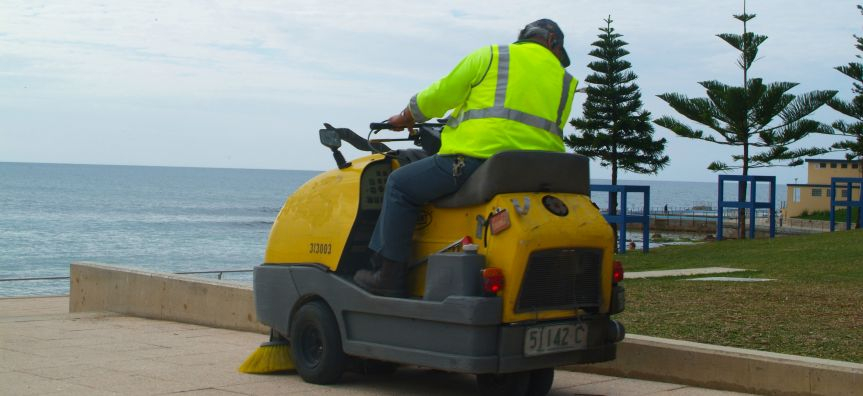 Person on cleaning machinery