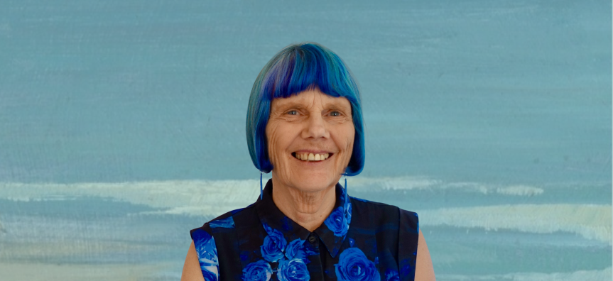 Photo of Nadia Wheatley in front of a canvas painted background
