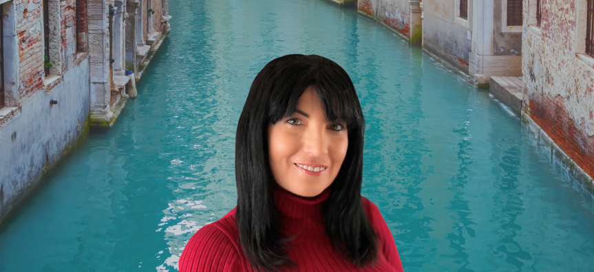 A photo of Tess Woods with a background of a Venice canal