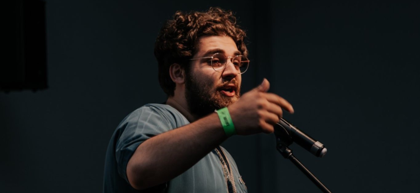 Poet Mohammad Awad performing poetry