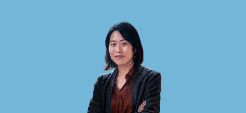 Photo of Tiffany Tsao in front of a blue background