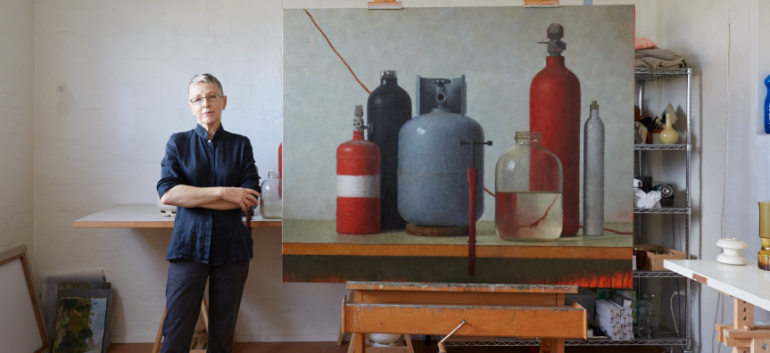 Artist Jude Rae with her painting in studio