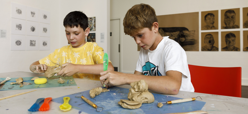 Boys creating with clay