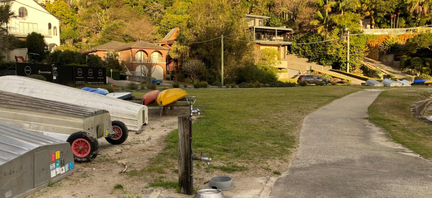 water tap and boats on grassed area