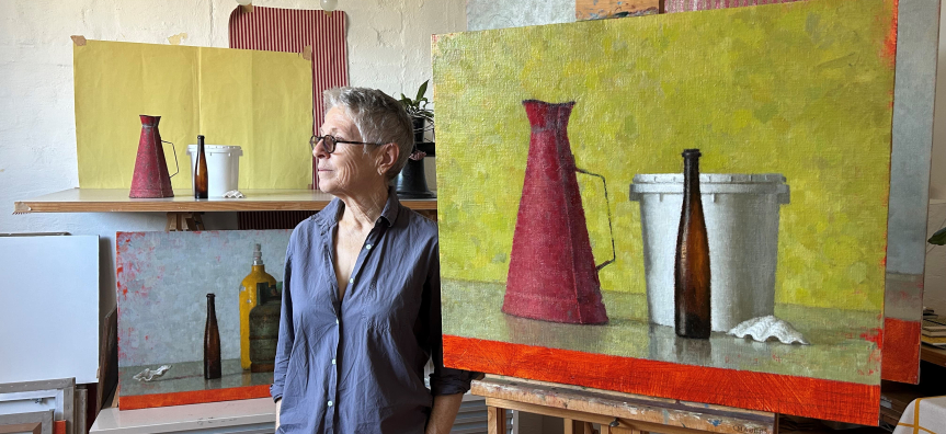 aRTIST jUDE rAE IN HER STUDIO WITH A PAINTING