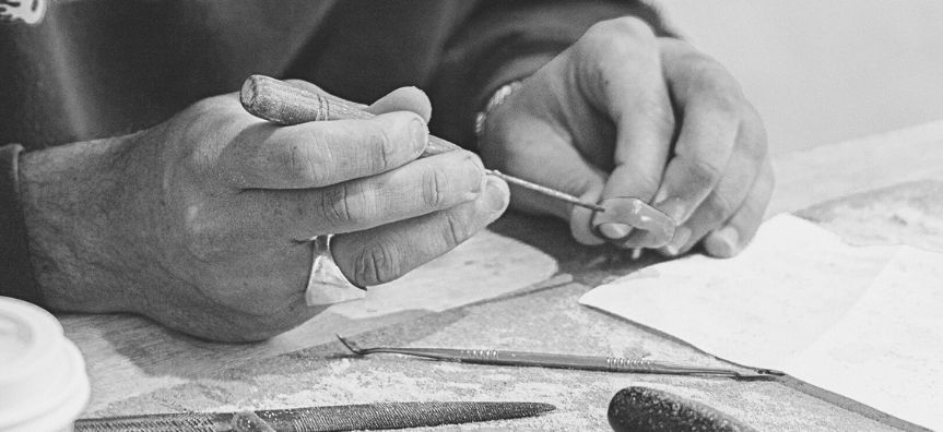 close up on hands making a ring with hand tools