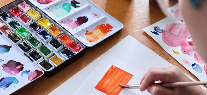 watercolour paints and paper