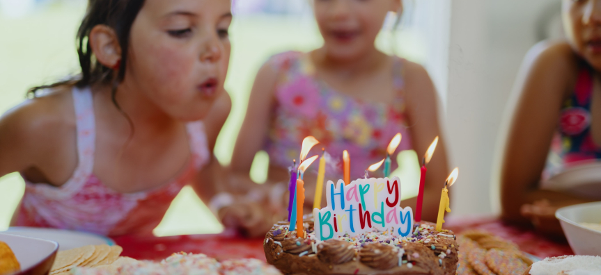 Child blowing out candles