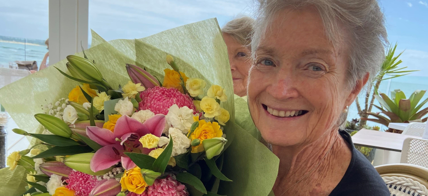 Ronda Alterator holding flowers